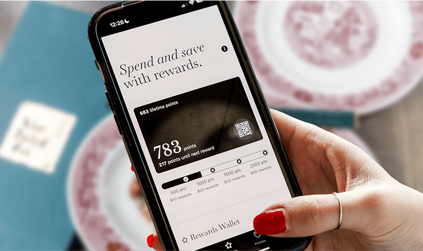Points-based rewards app on smartphone showing loyalty points and rewards balance.